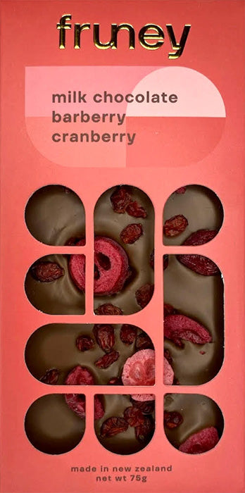 Fruney milk chocolate barberry cranberry packaging on a pink background